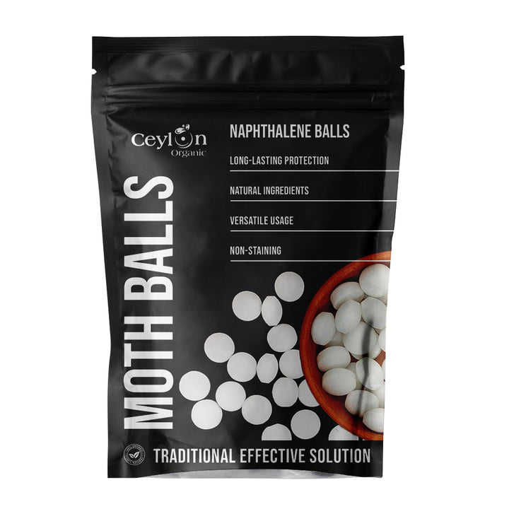 White moth balls for clothes protection, natural pest repellent for wardrobes, closets, and storage spaces.