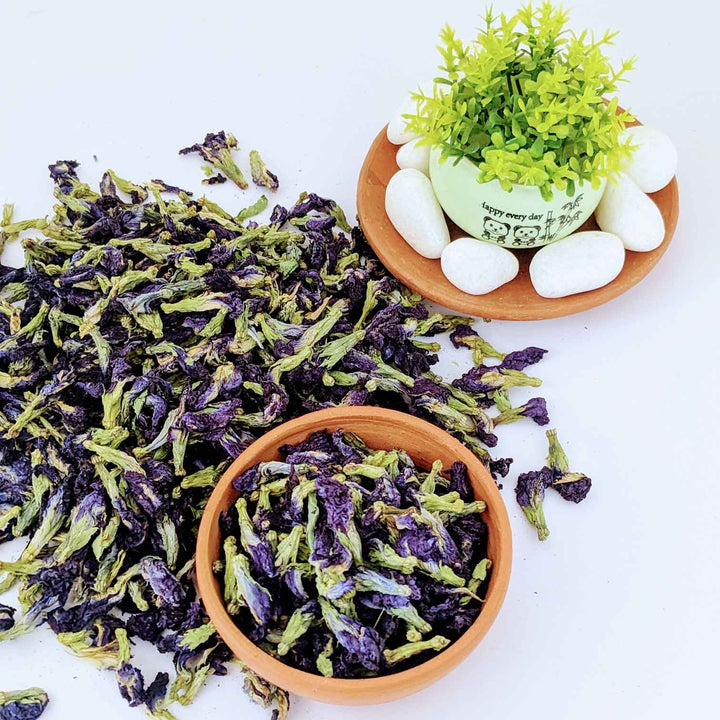 A bowl of butterfly pea flowers showcasing their vibrant color, used in butterfly pea tea.