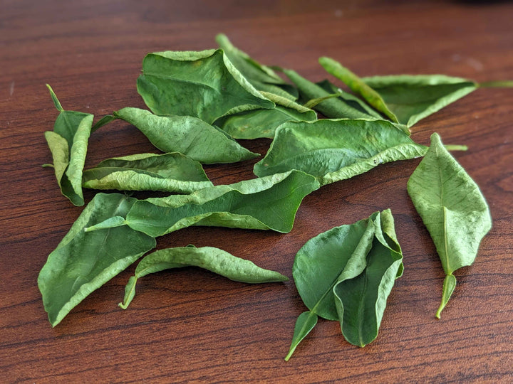 Natural Sri Lankan dried lime leaves for Asian dishes,lime leaves for soup, lime leaf aroma, dehydrated lime leaves, dried lime leaf flakes, herbal lime leaves, kaffir lime herb, tropical lime leaves, lime leaf flavor, pure lime leaves, aromatic lime leaves, culinary lime leaves, lime leaves for tea, dried lime leaves wholesale, lime leaves online, lime leaf exporters Sri Lanka, 100% natural lime leaves, lime leaves for restaurants