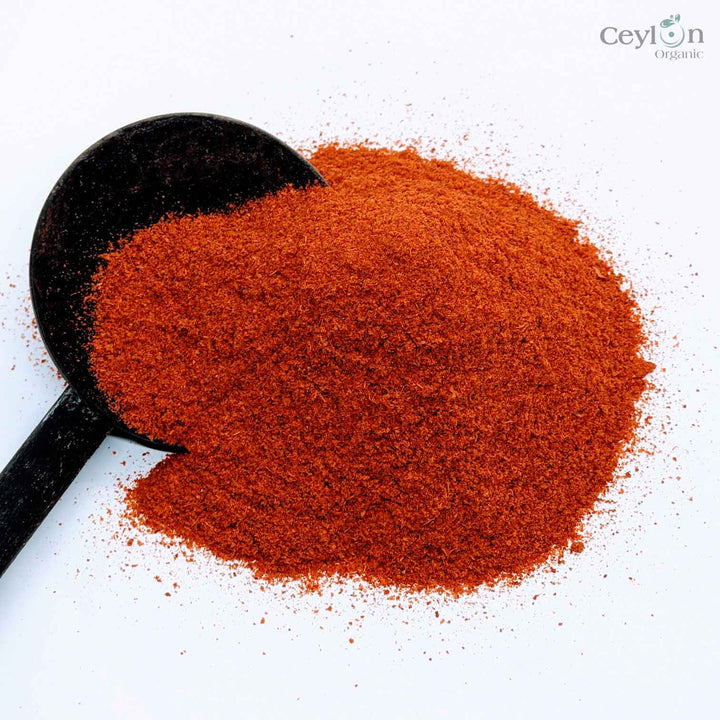 A vibrant red powder made from dried and ground chili peppers. It is a staple ingredient in many cuisines around the world, and adds a bold, spicy flavor to dishes.